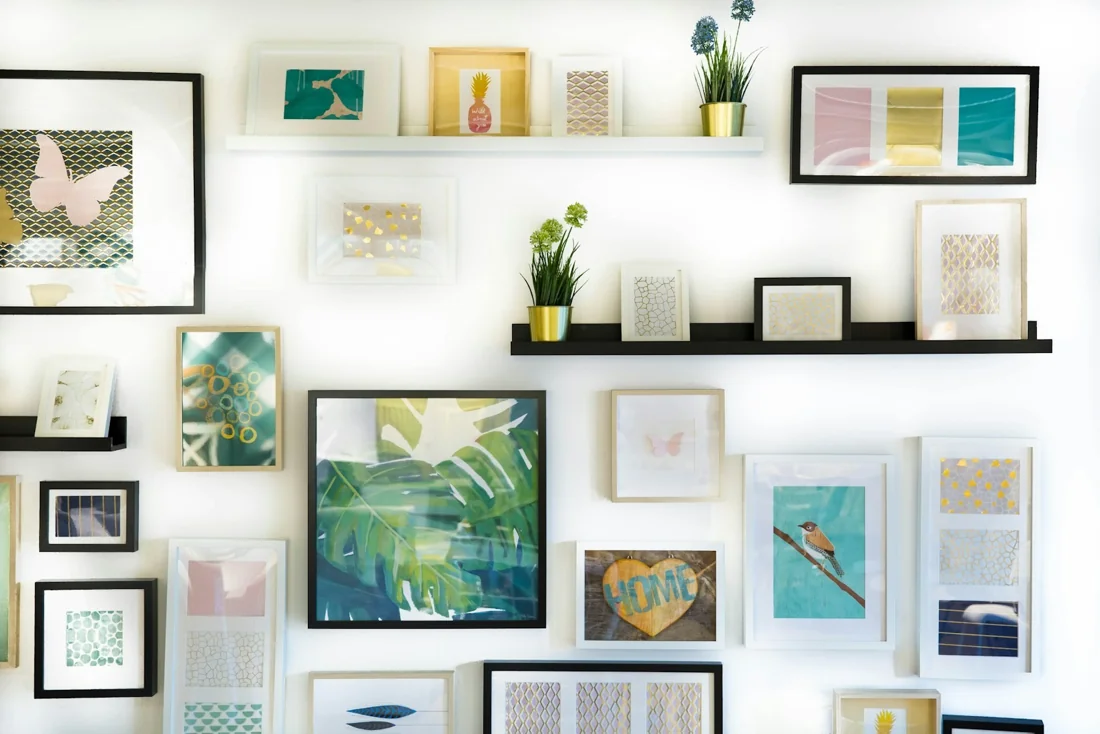 An organized wall of prints and books